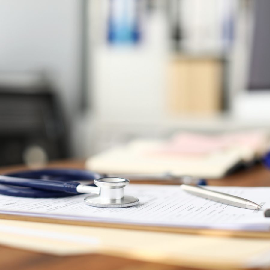 Stethoscope,Head,Lying,At,Worktable,Over,Patient,Medical,History,Paper