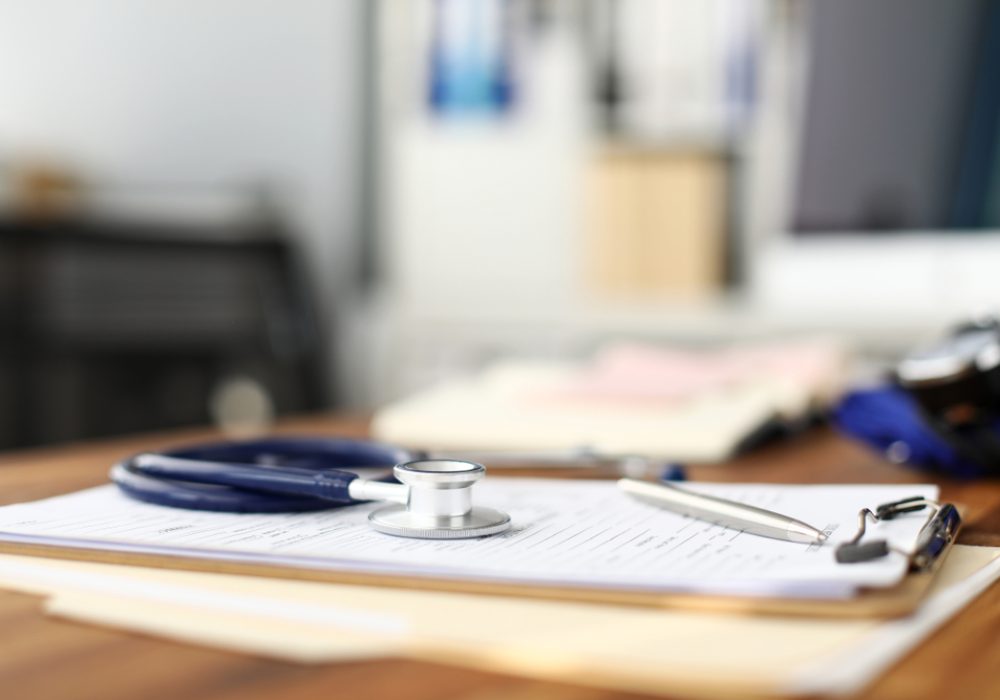 Stethoscope,Head,Lying,At,Worktable,Over,Patient,Medical,History,Paper