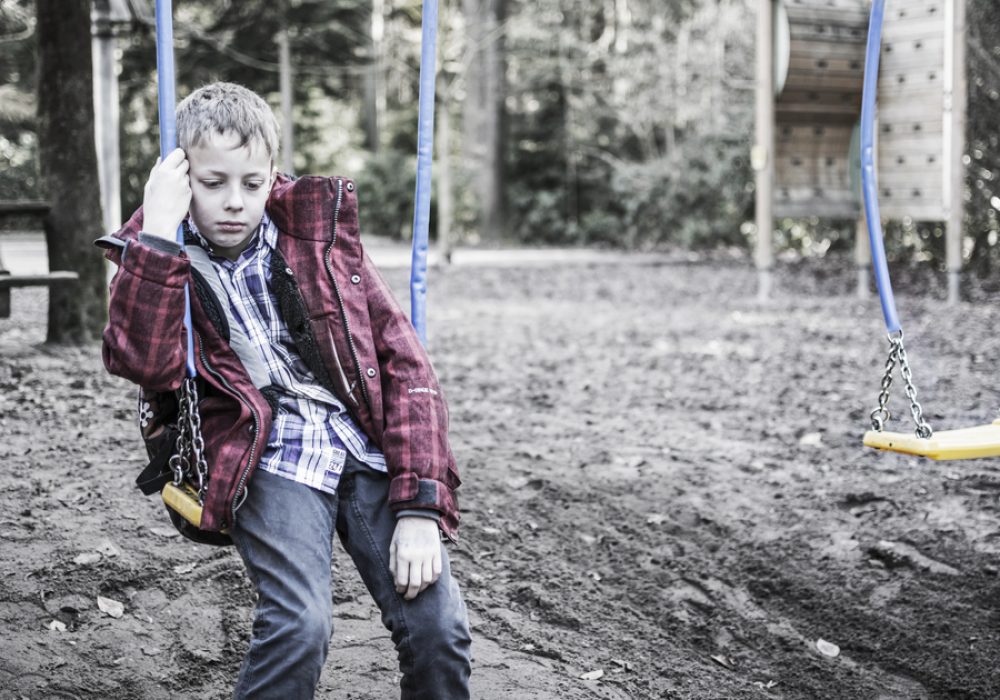 Sad,Lonely,Boy,Sitting,On,Swing