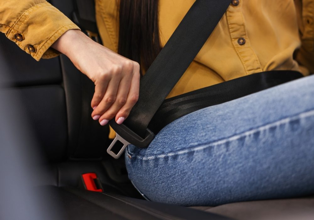 Woman,Fastening,Safety,Seat,Belt,Inside,Modern,Car,,Closeup