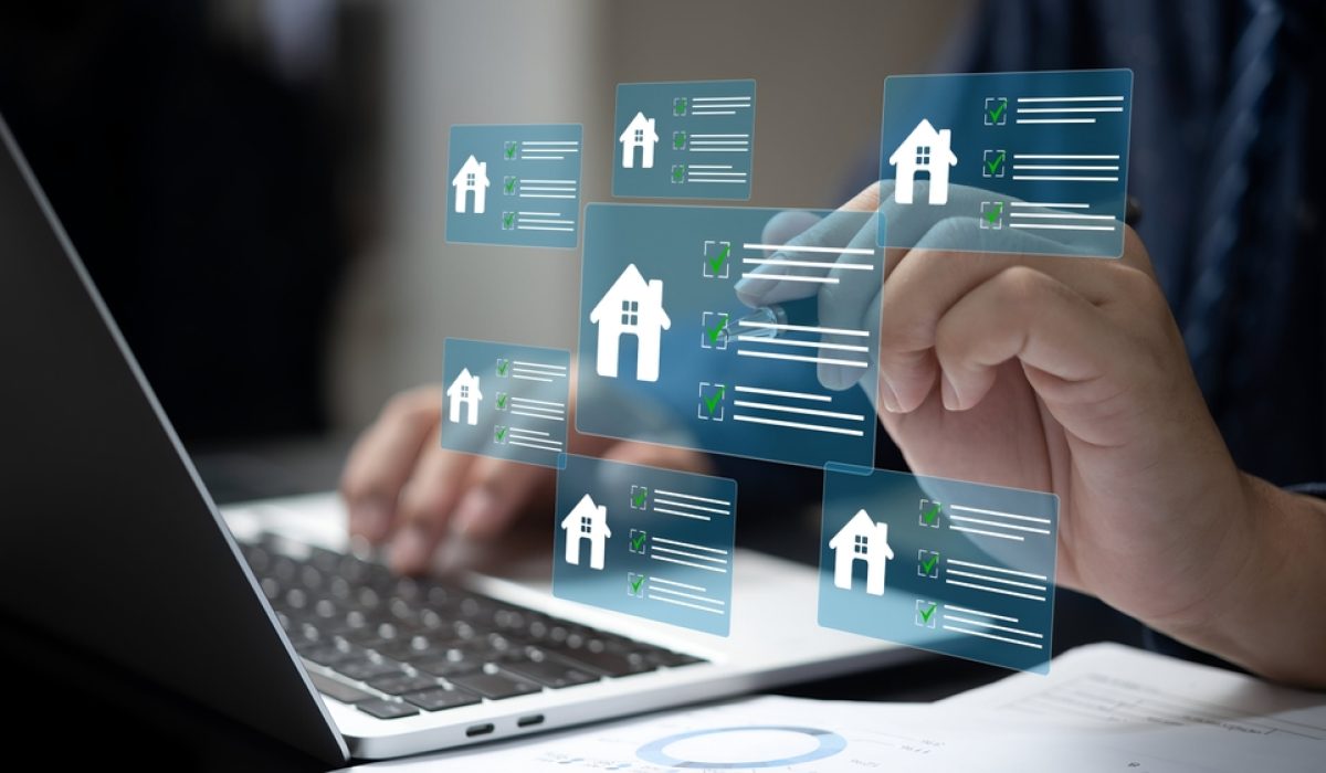 A,Business,Person,Using,Laptop,With,Real,Estate,Checklist,Concept.