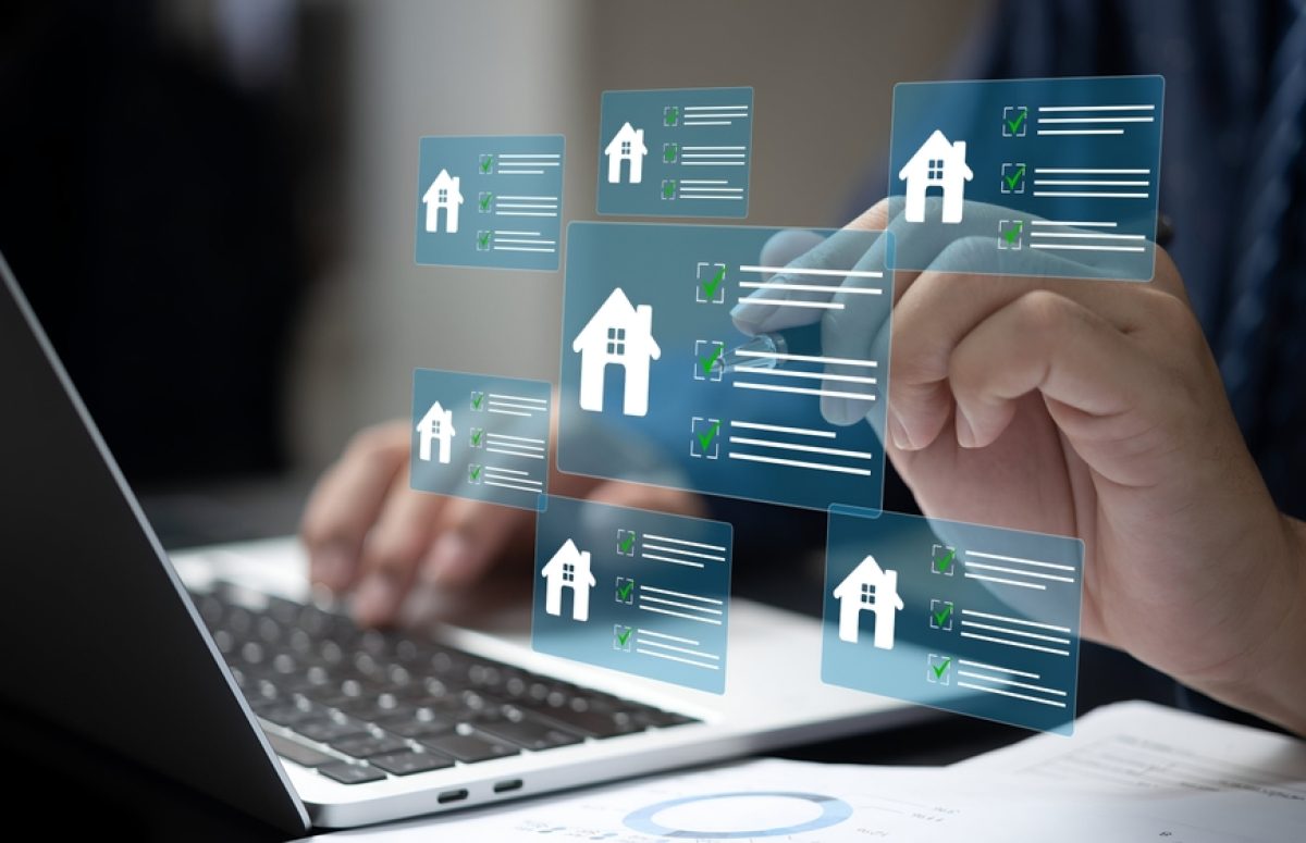 A,Business,Person,Using,Laptop,With,Real,Estate,Checklist,Concept.