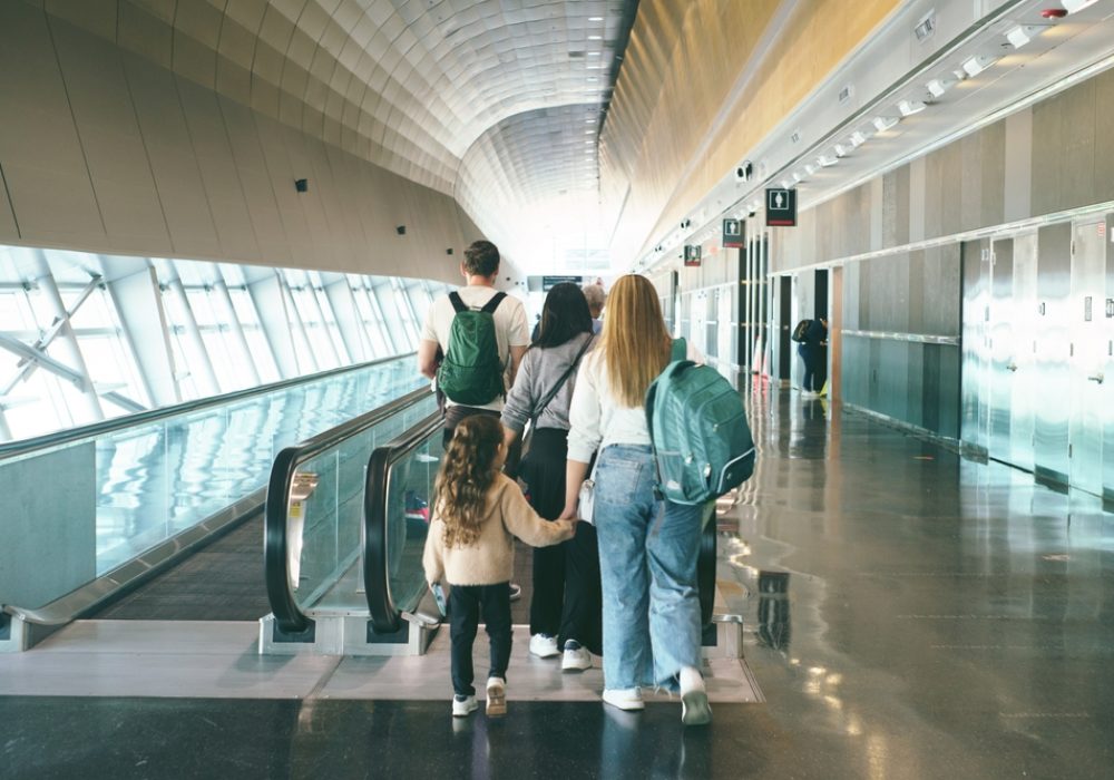 Miami,florida,usa,,04,24,2025,,Family,With,Backpacks,Walking,On,Moving