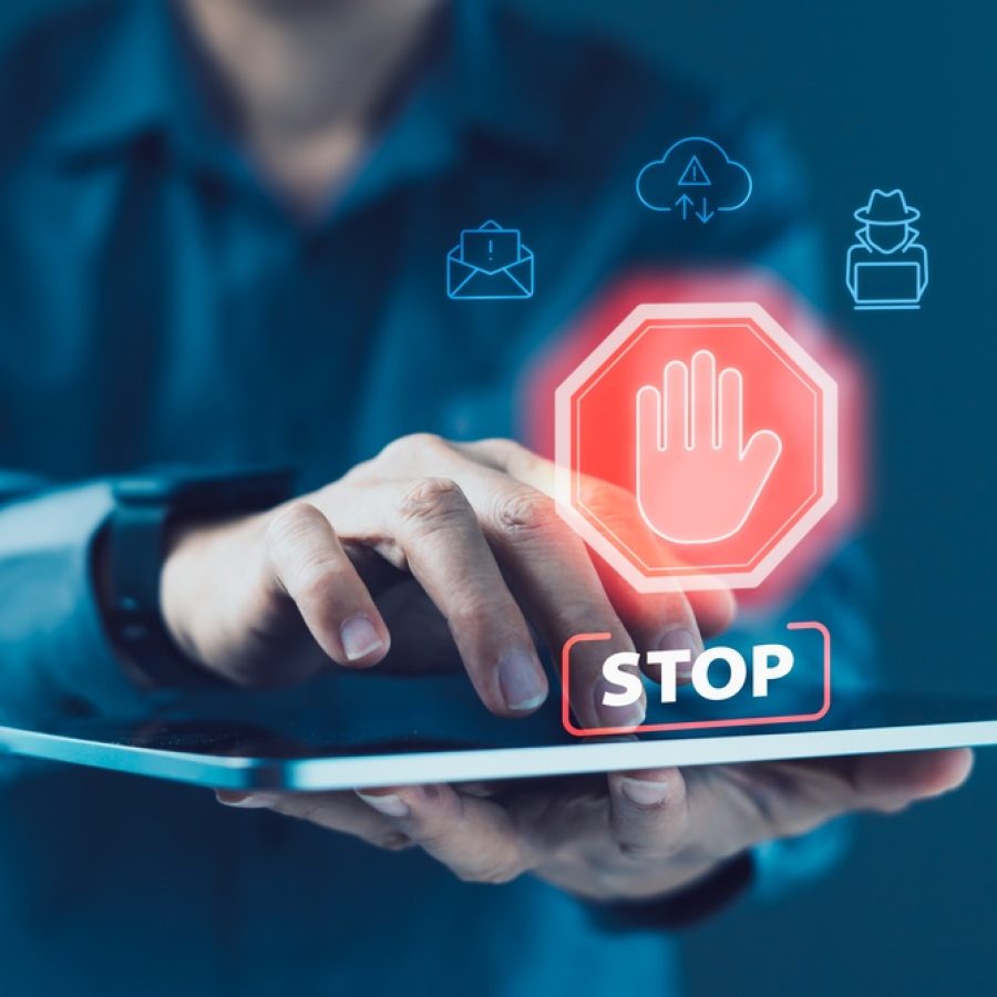 Business,User,Interacting,With,Tablet,Displaying,Stop,Warning,Icon,With