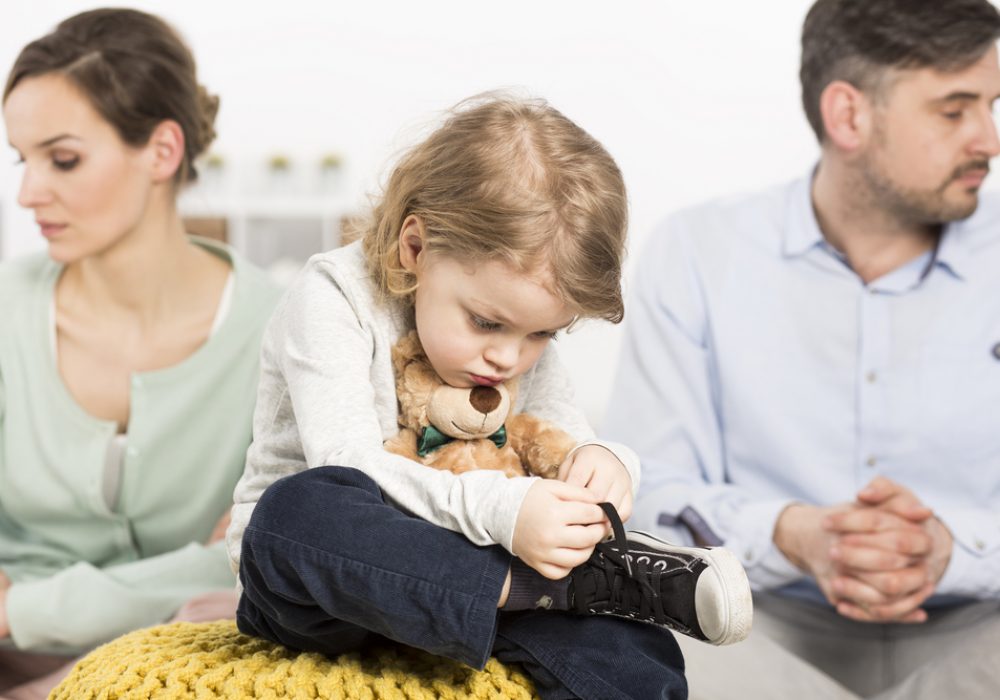 Photo,Of,A,Gloomy,Young,Family,With,A,Sad,Little